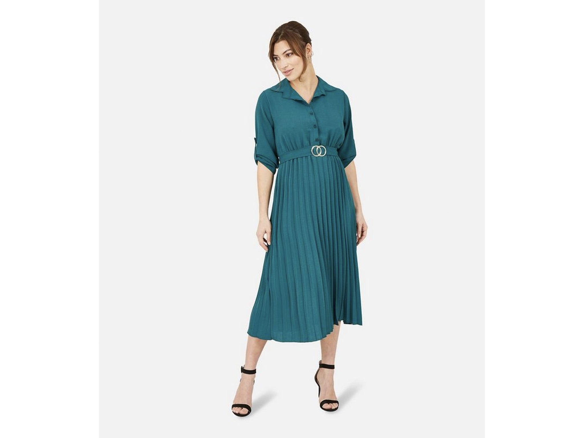 Kate Middleton wears a teal Edeline Lee dress to present an award